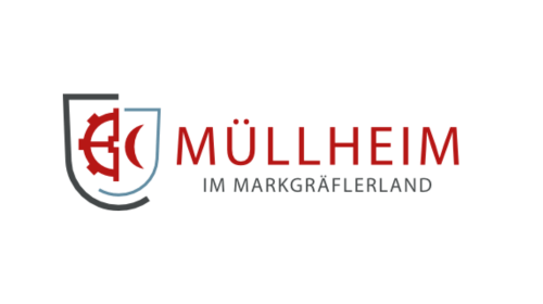 Logo von Müllheim im Markgräflerland mit Wappen und rotem Text "MÜLLHEIM IM MARKGRÄFLERLAND".
